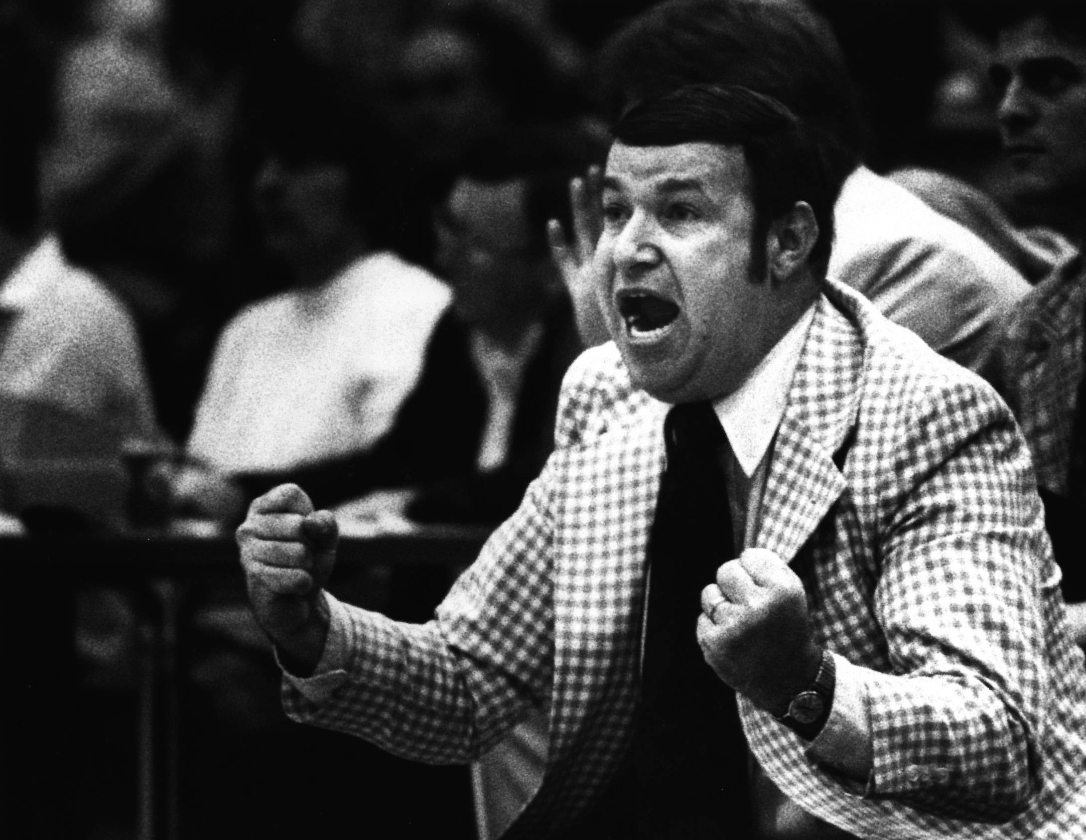 Coach Herb Cohen shouting from the sideline in his checkered jacket, 1979